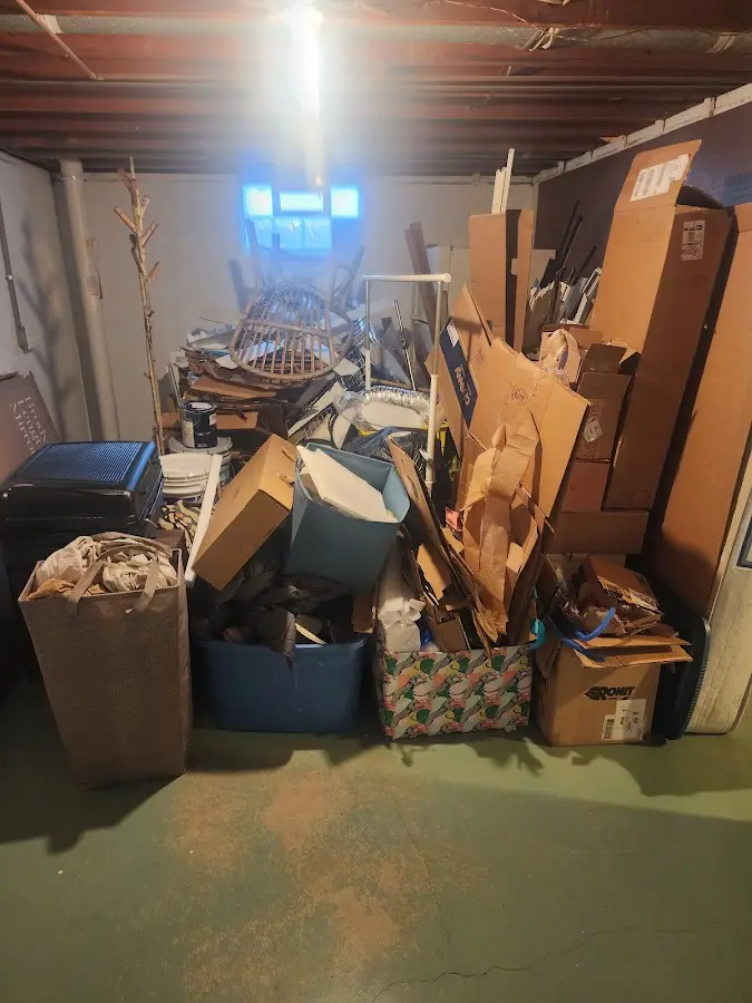 Roll-off dumpster container at job site for 2 Yard Dumpster Rental in Bryan